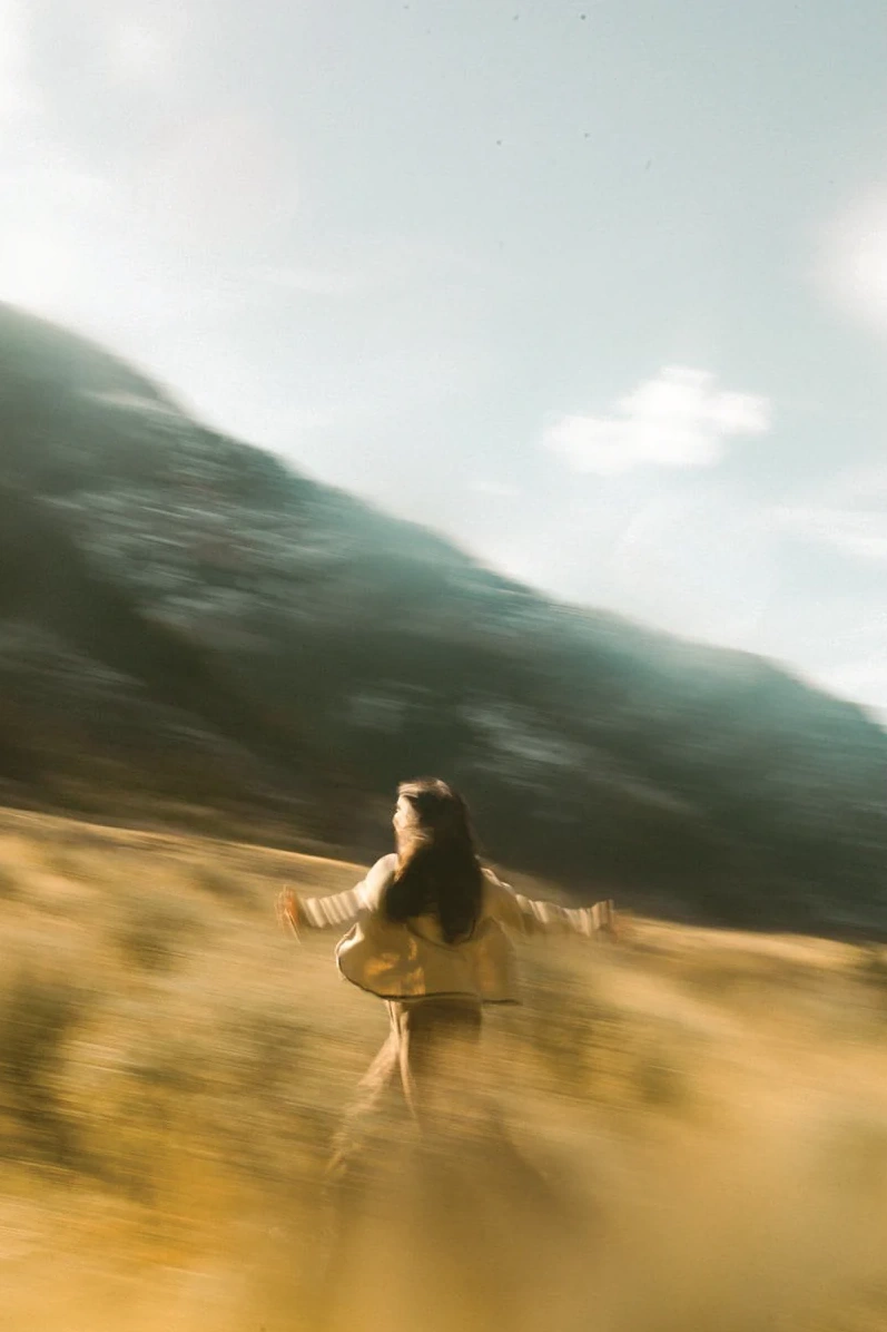 A moving figure in a landscape